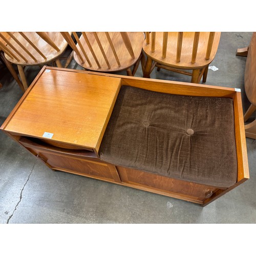 82 - A teak telephone seat