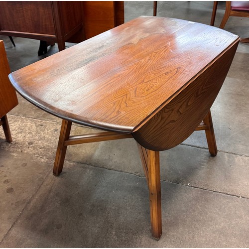 89 - An Ercol Golden Dawn elm drop leaf table