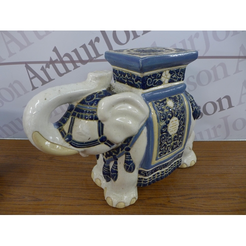 2330 - A Chinese blue and white urn marked with Chinese markings to base with a Chinese style elephant stan... 