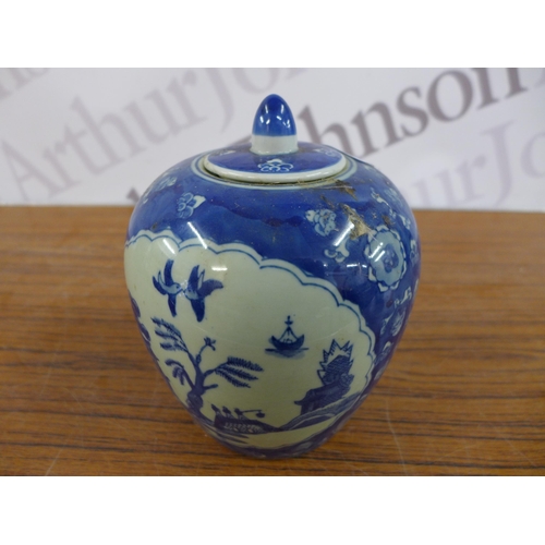 2330 - A Chinese blue and white urn marked with Chinese markings to base with a Chinese style elephant stan... 