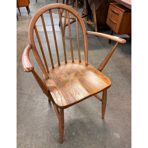 90 - An Ercol elm and beech Windsor elbow chair