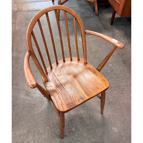 90 - An Ercol elm and beech Windsor elbow chair