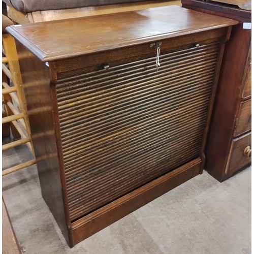 172 - An early 20th Century oak tambour front filing cabinet