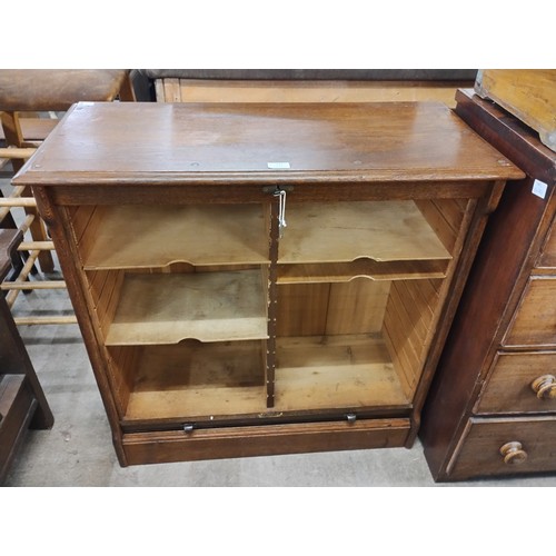 172 - An early 20th Century oak tambour front filing cabinet