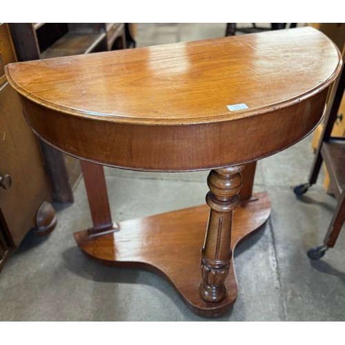 214 - A Victorian walnut demi-lune washstand