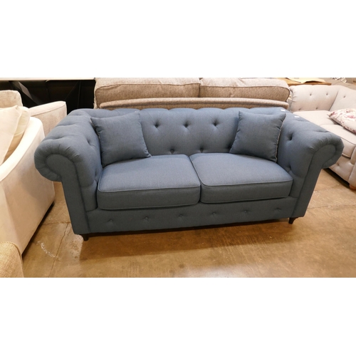 1491 - A blue weave Chesterfield three seater sofa - brand new RRP £1379