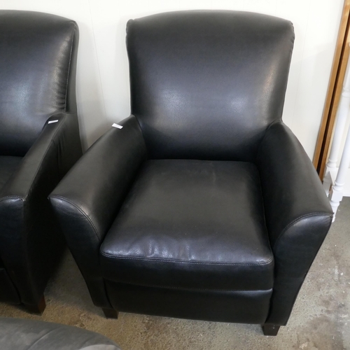 1503 - A black leather effect armchair