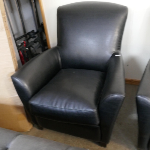 1504 - A black leather effect armchair