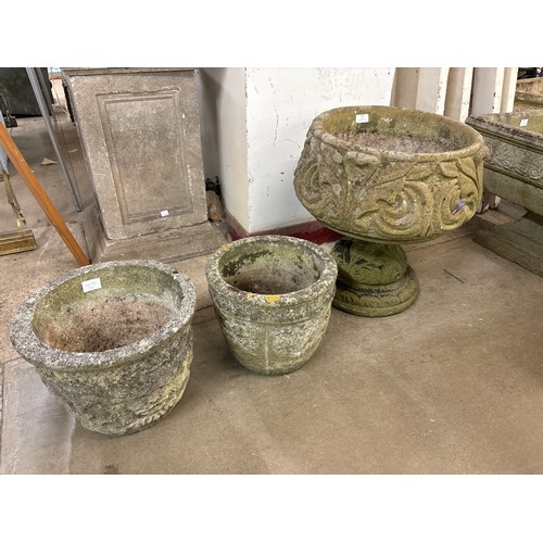 251 - A concrete garden planter on stand and two others