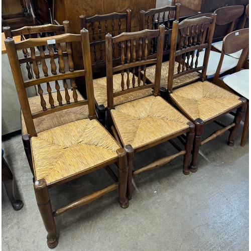 240 - A Harlequin set of six 18th Century style elm and rush seated chairs