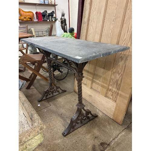 255 - A Victorian cast iron and slate topped pub table