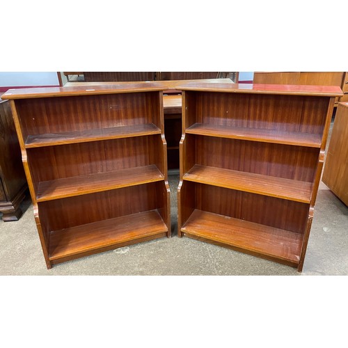 97 - A pair of teak waterfall front open bookcases