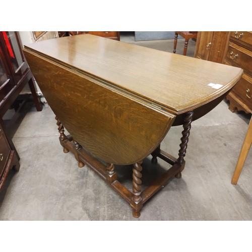 184 - An oak barleytwist gateleg table