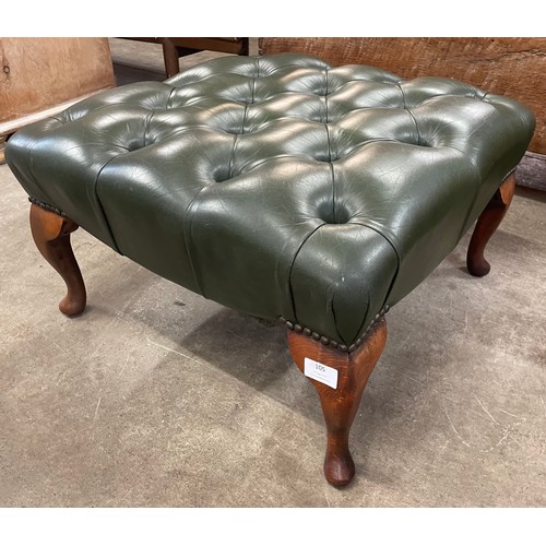 105 - A green leather Chesterfield footstool