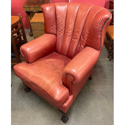 108 - A red leather wingchair armchair