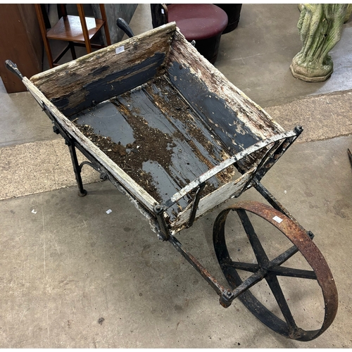 262 - A pine and wrought iron wheelbarrow