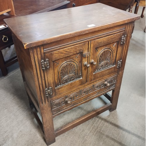 197 - A 17th Century style carved oak two door credence cupboard