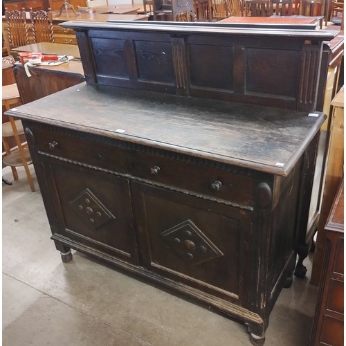 198 - An early 20th Century carved oak dresser