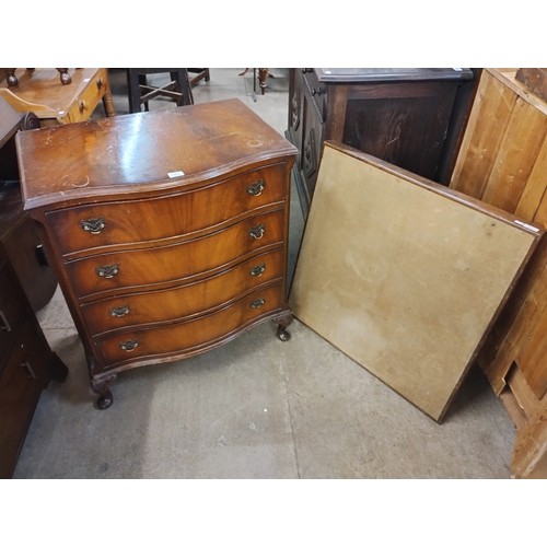 199 - A George III style mahogany serpentine chest of drawers and a card table