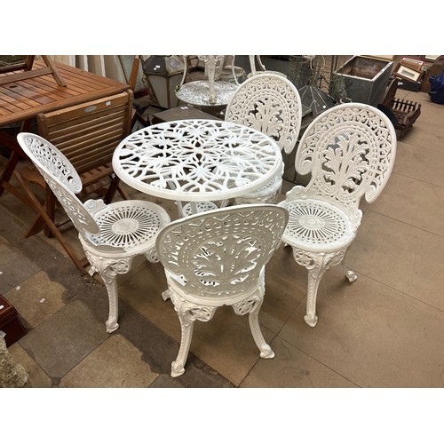 276 - A painted cast alloy garden table and four chairs