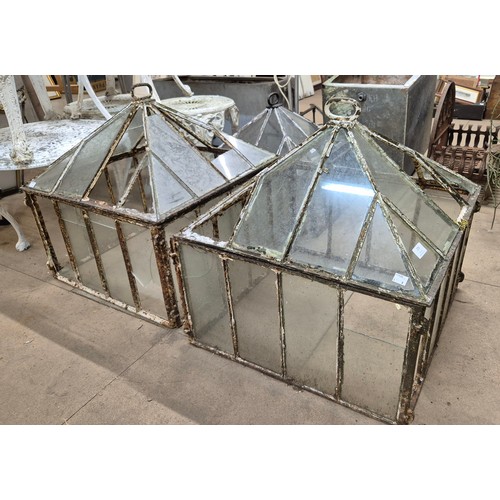 278 - A pair of Victorian cast iron and glass panelled cloches