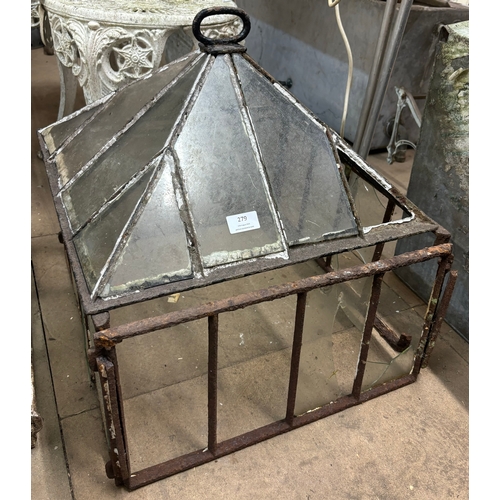 279 - A Victorian cast iron cloche and a wire cage