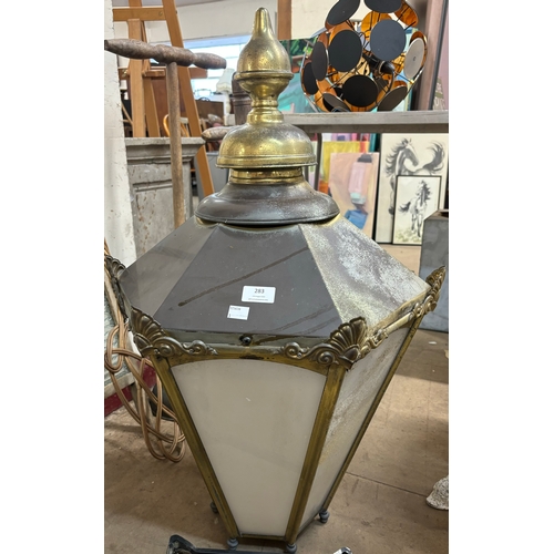 283 - A Victorian style brass wall mounted lantern