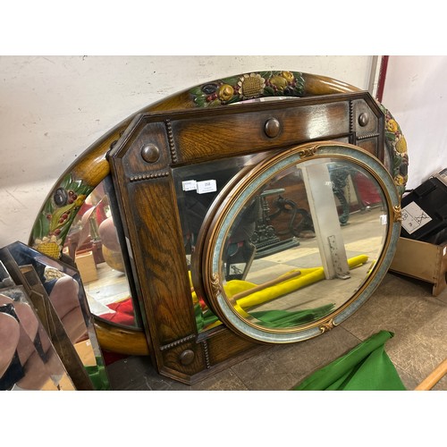 358 - An early 20th Century oak framed mirror and two others