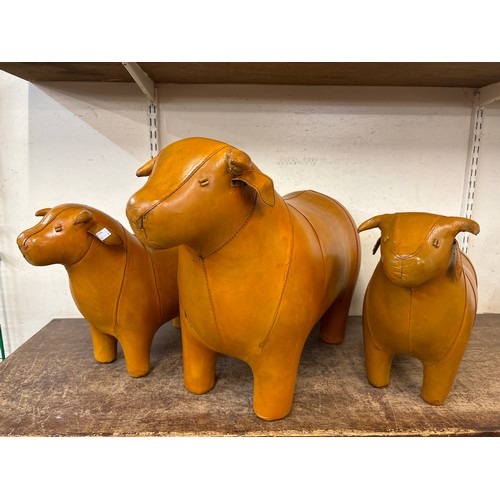 347 - Three Liberty & Co. style butterscotch leather bull footstools