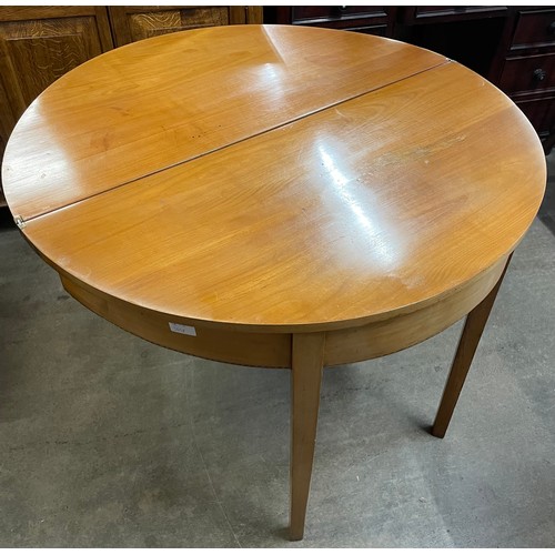 147 - A George IV mahogany and satinwood inlaid demi-lune fold over tea table