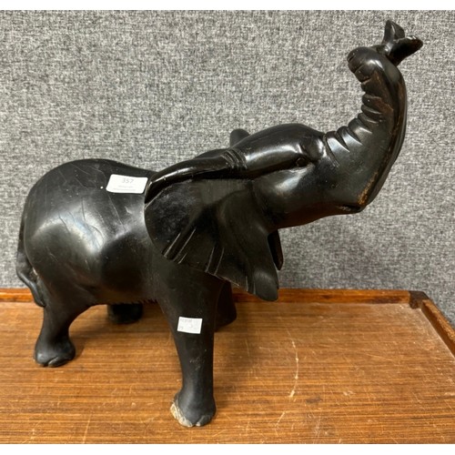 337 - An African carved ebonised figure of an elephant