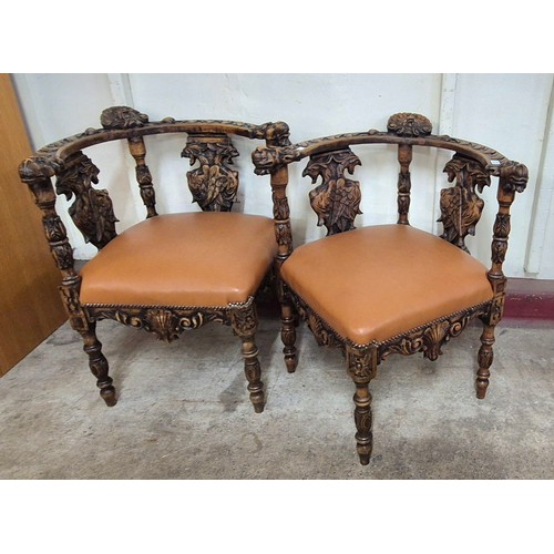 109 - A pair of 19th Century style Italian Baroque Revival carved beech corner chairs