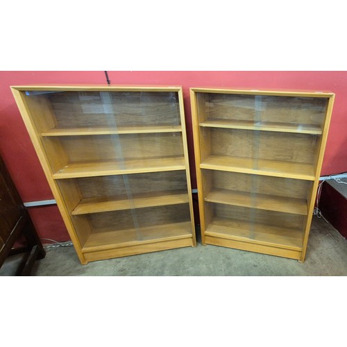 63 - A pair of teak bookcases