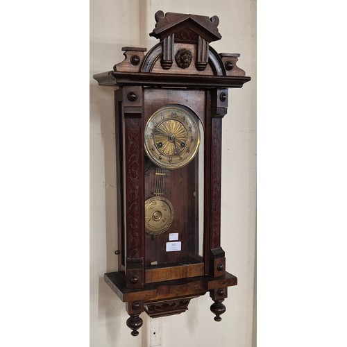 345 - A 19th Century carved mahogany Vienna wall clock