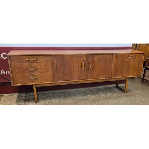 23 - A teak sideboard