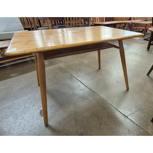 35 - An Ercol Blonde elm and beech 393 model low breakfast table