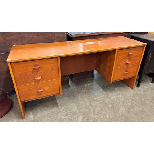 42 - A Stag Cantata teak desk, designed by John & Sylvia Reid