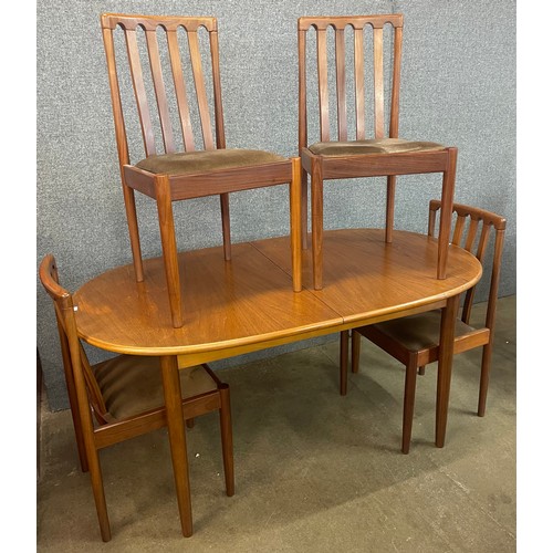 5 - A Meredew teak extending dining table and four chairs