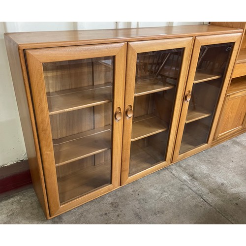 17 - An Ercol Blonde elm Windsor bookcase