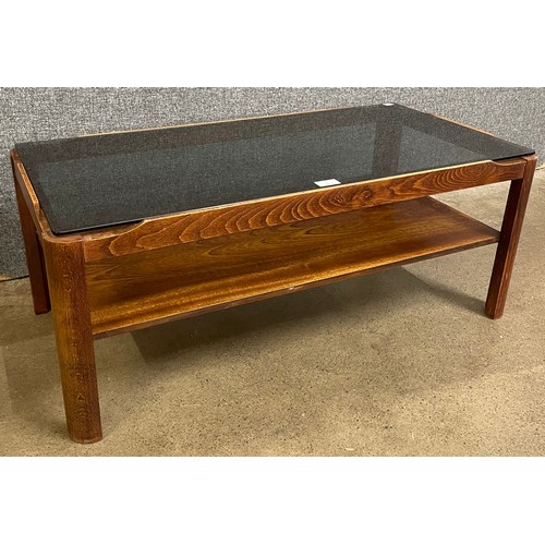 27 - A Myer teak and glass topped coffee table