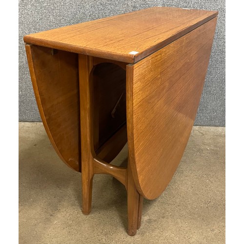 29 - A teak drop leaf table