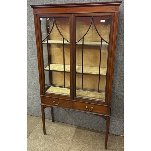 103 - An Edward VII inlaid mahogany two door display cabinet