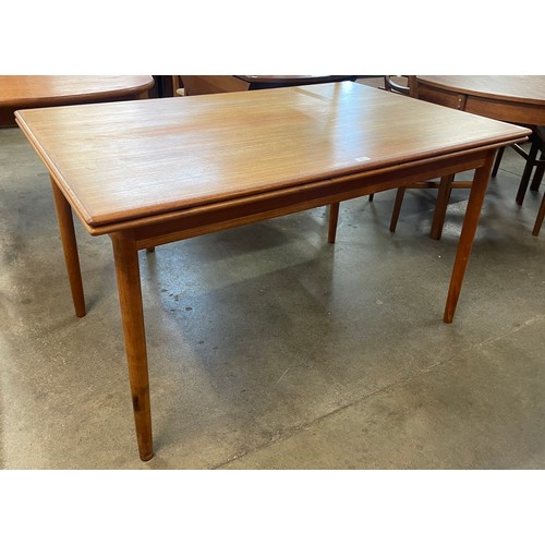 43 - A Danish teak draw leaf dining table