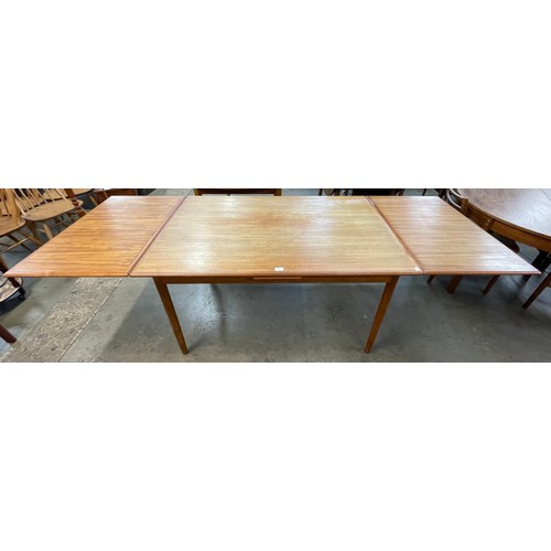 43 - A Danish teak draw leaf dining table