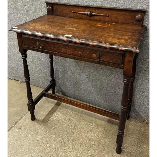 108 - A 17th Century style oak single drawer side table