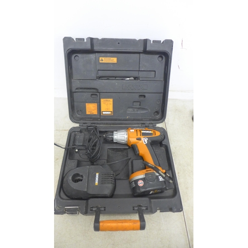 2018 - A Tesco SD482G mini drill, a WorkX WX14DD, 14.4V drill with battery and charger in case and a quanti... 