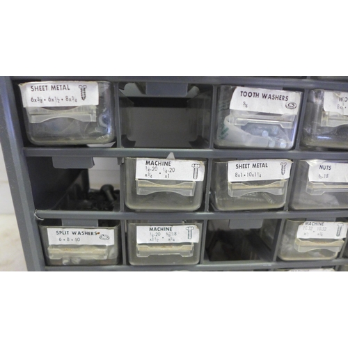 2038 - A 25 compartment organiser with a large quantity of various screws and bolts etc.