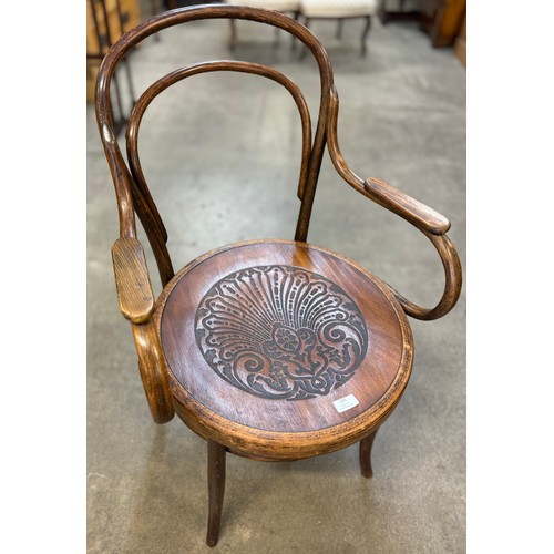 123 - An early 20th Century Austrian Mundus beech bentwood elbow chair