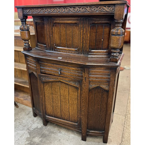 124 - An early 20th Century carved oak court cupboard