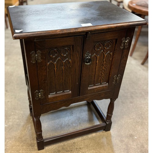 126 - A 17th Century style carved oak credence cupboard